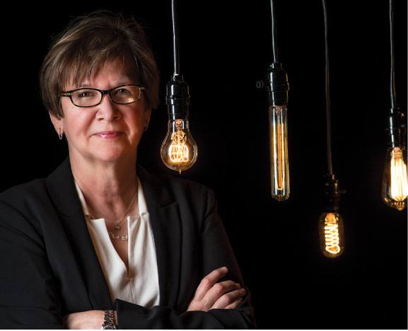 portrait of sherri oldham with bulbs in the background